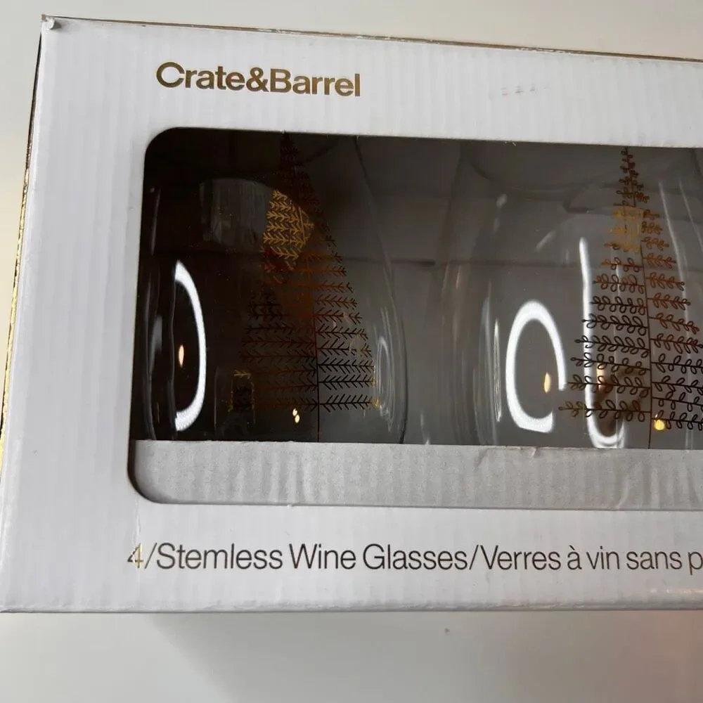 Crate & Barrel boxed set of 4 stemless wine glasses featuring a holiday tree des